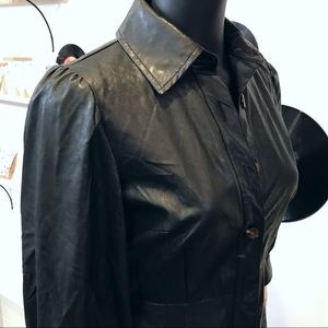 Black faux leather shirt dress with pockets.